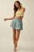 Blue Belle Smocked Denim Pleated Wrap Mini Skort - ShopPromesa