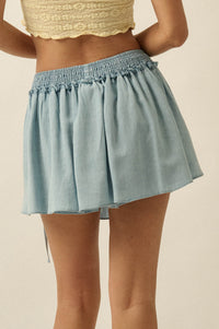 Blue Belle Smocked Denim Pleated Wrap Mini Skort - ShopPromesa