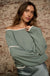 Cuddle Party Cropped Exposed-Seam Sweater