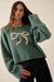 Let It Bow Exposed-Seam Bow Jacquard Knit Sweater